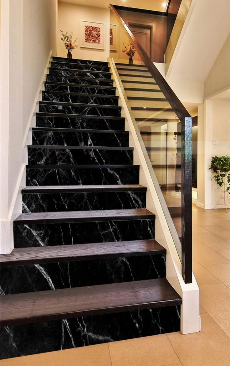 Black marble staircase with wood treads